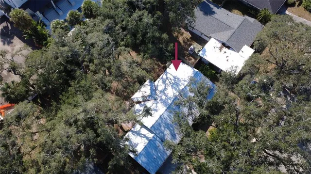 a view of backyard of house with green space