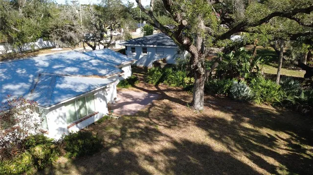 a view of backyard with green space