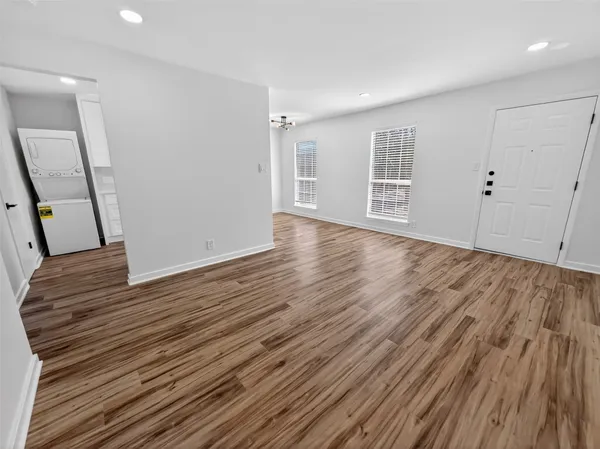 a open kitchen with stainless steel appliances a refrigerator sink and cabinets