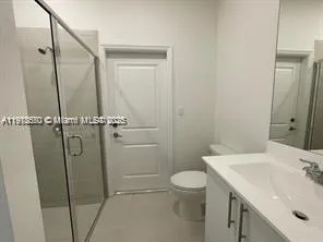 a view of a hallway with staircase