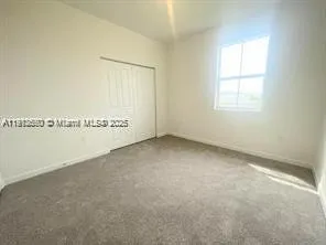 a view of a room with an empty space