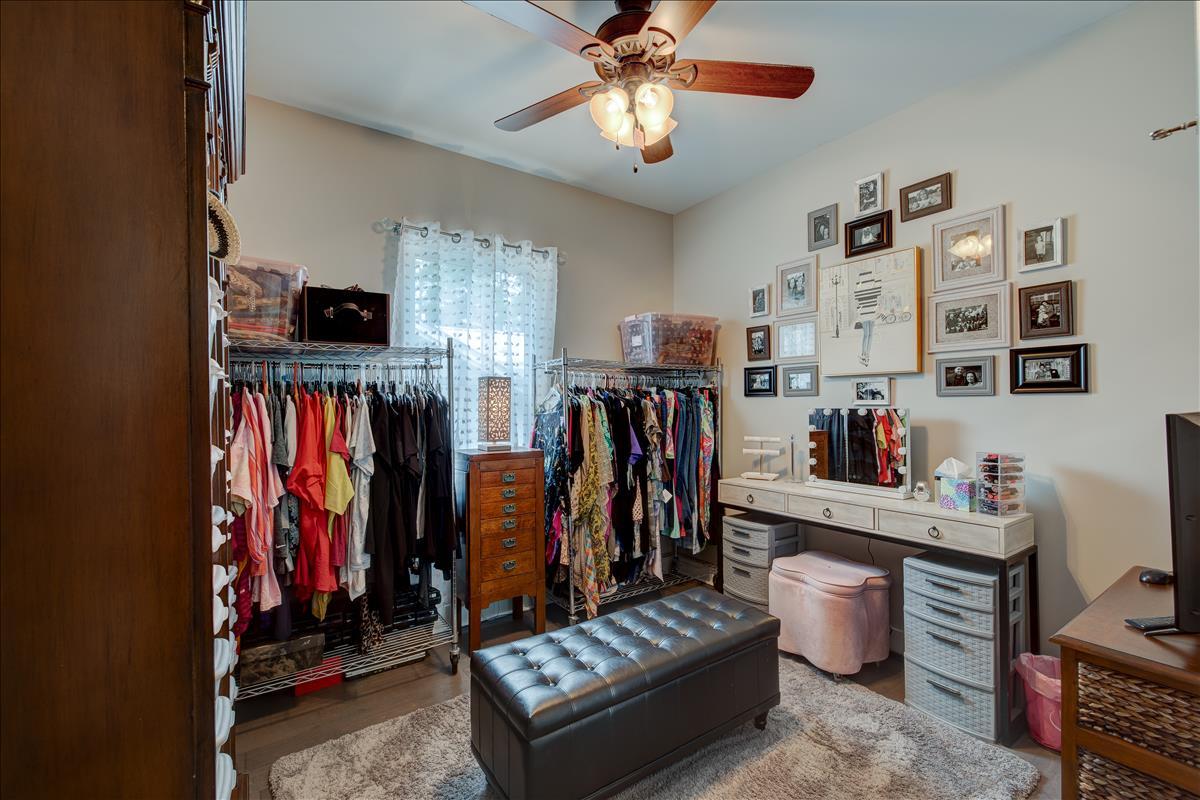61 Beacon Point Drive Santa Rosa Beach, FL 32459 - Photo 22 of 30 a living room with lots of furniture and clothes