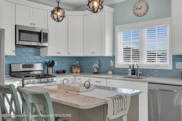 a balcony with table and chairs