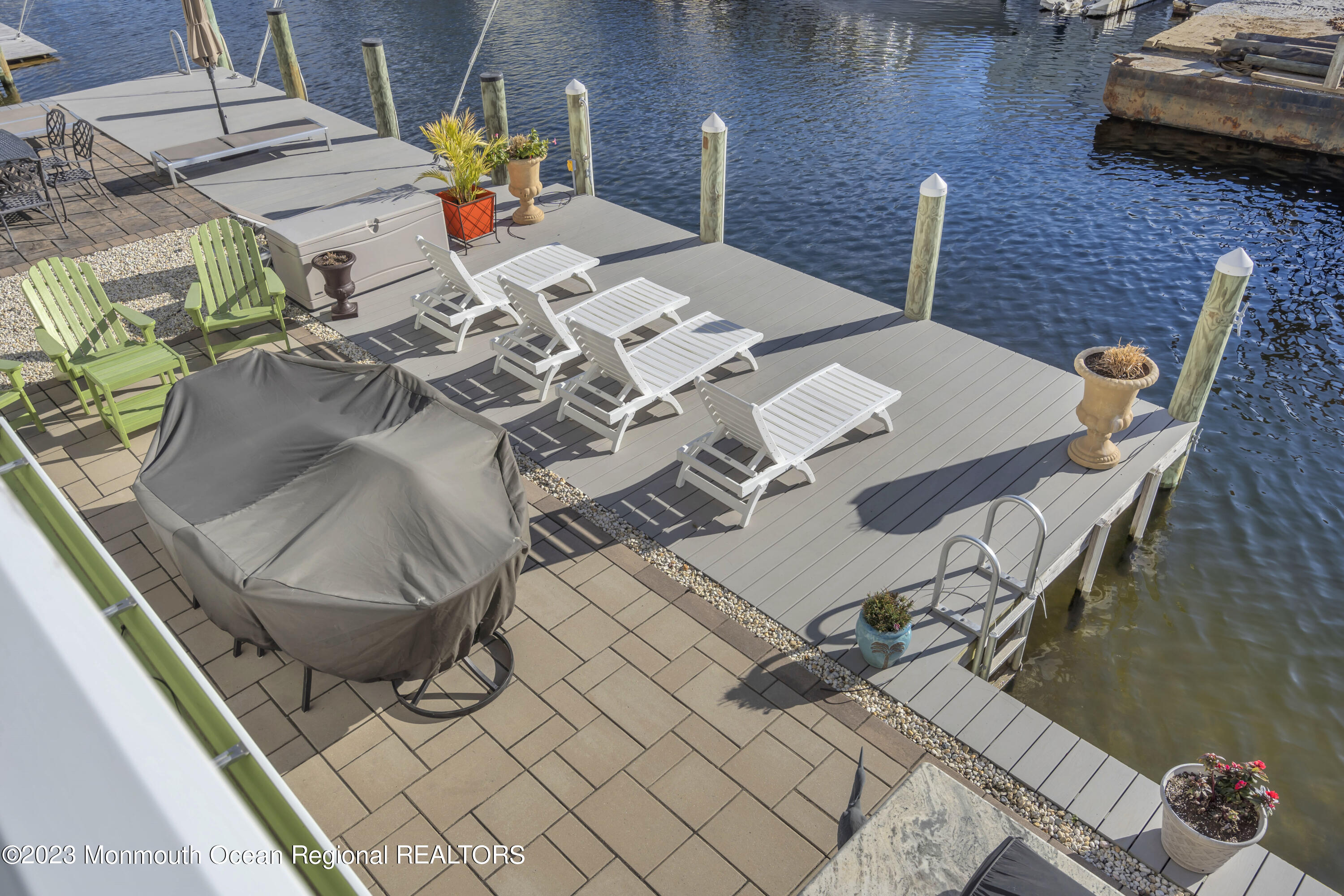 411 Harding Avenue Seaside Heights, NJ 08751 - Photo 35 of 71 a view of a patio with table and chairs couches with wooden floor