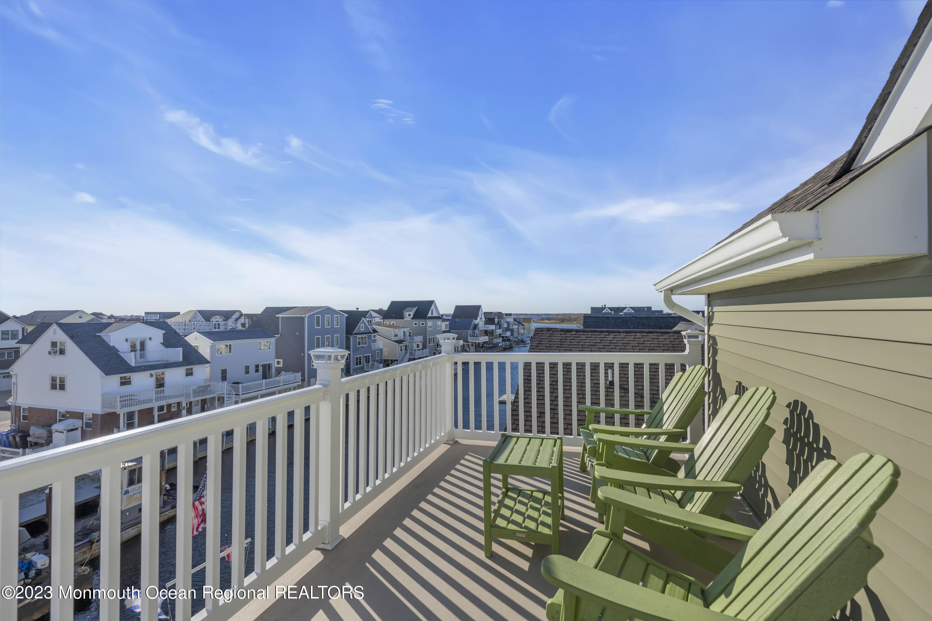 411 Harding Avenue Seaside Heights, NJ 08751 - Photo 36 of 71 a view of balcony with wooden floor and seating space