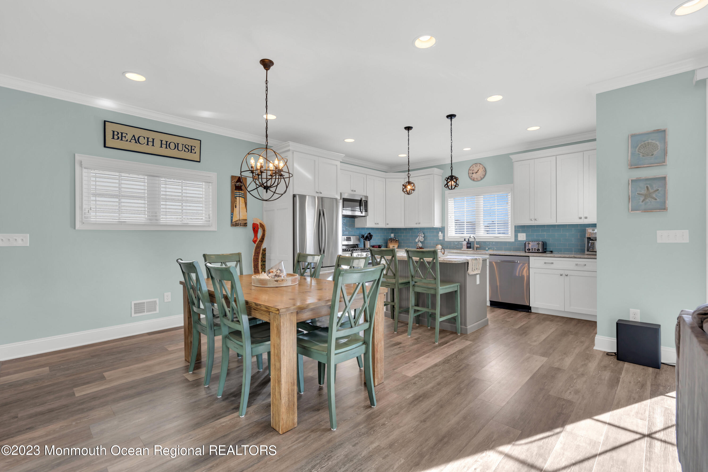411 Harding Avenue Seaside Heights, NJ 08751 - Photo 37 of 71 a view of a dining room and livingroom with furniture wooden floor a chandelier