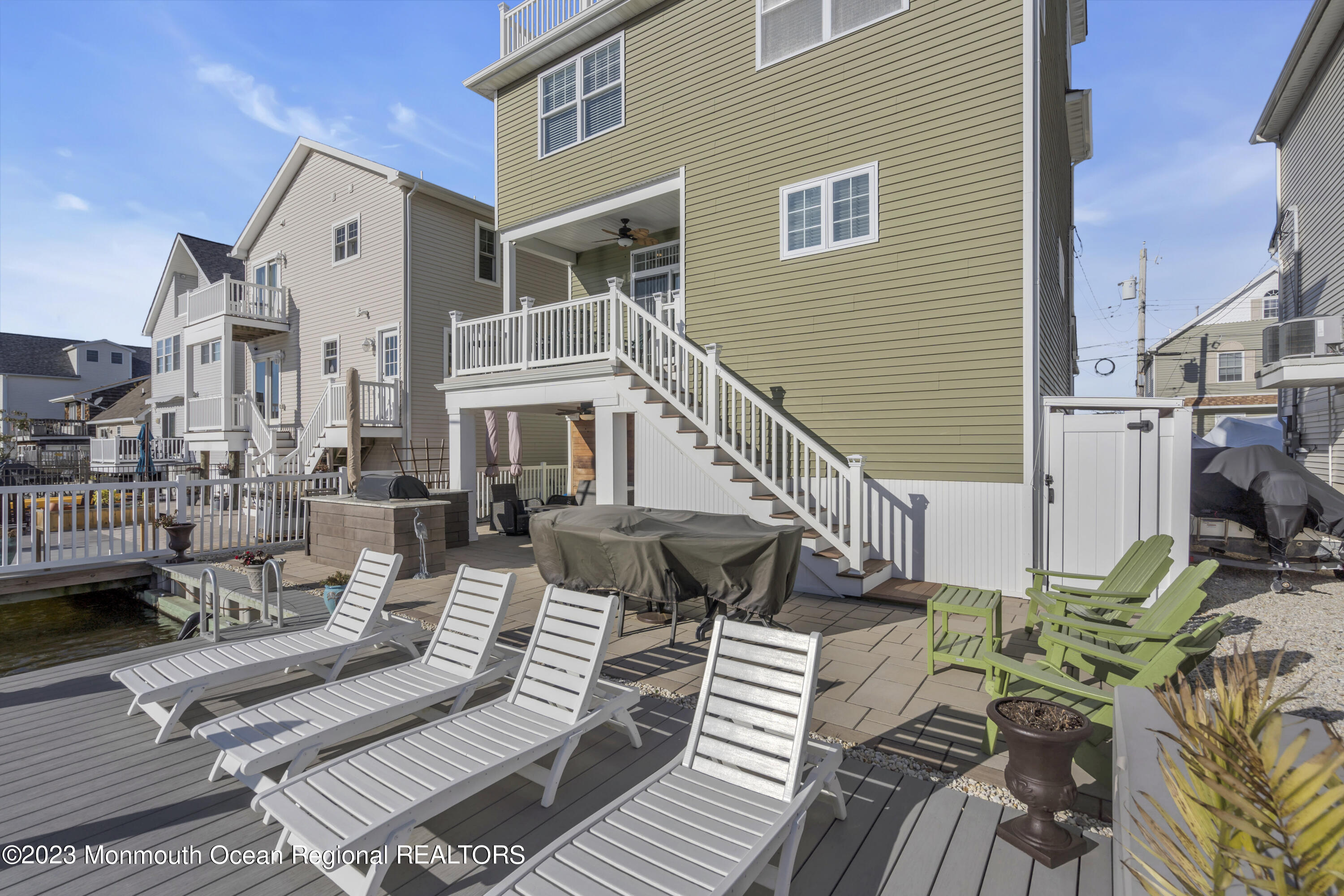 411 Harding Avenue Seaside Heights, NJ 08751 - Photo 70 of 71 a view of a patio with couches table and chairs and potted plants