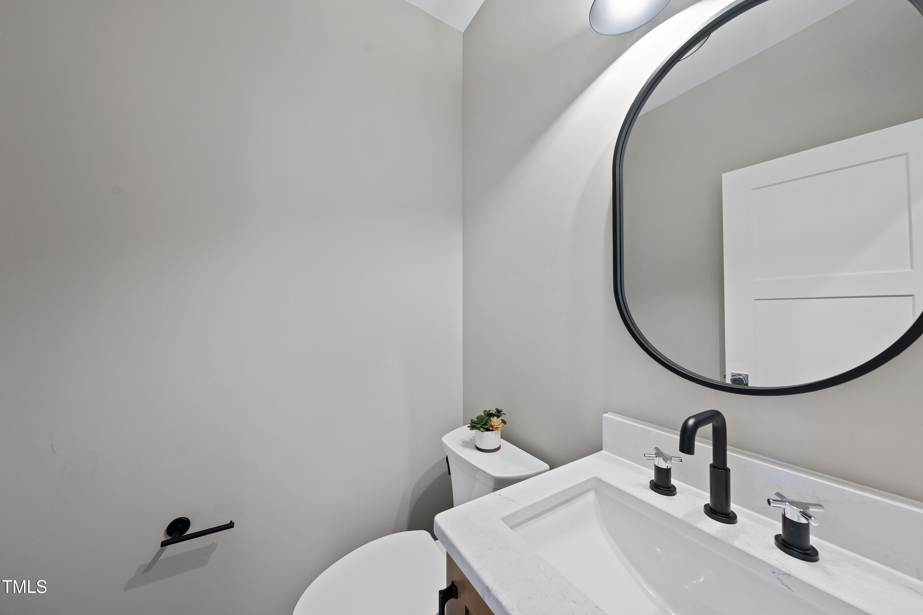 10119 2nd Star Court Raleigh, NC 27613 - Photo 18 of 39 a bathroom with a sink and a mirror