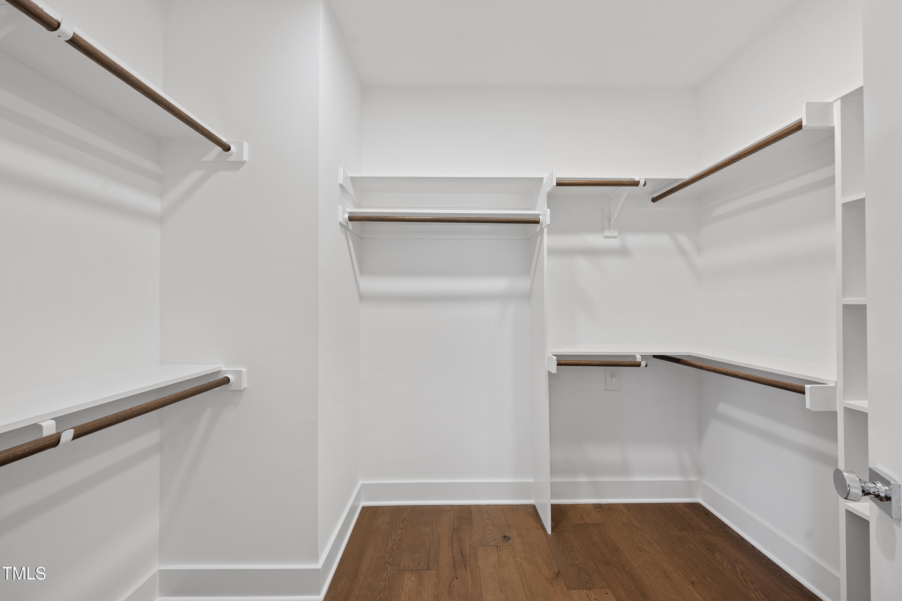 10119 2nd Star Court Raleigh, NC 27613 - Photo 24 of 39 a view of walk in closet with empty racks