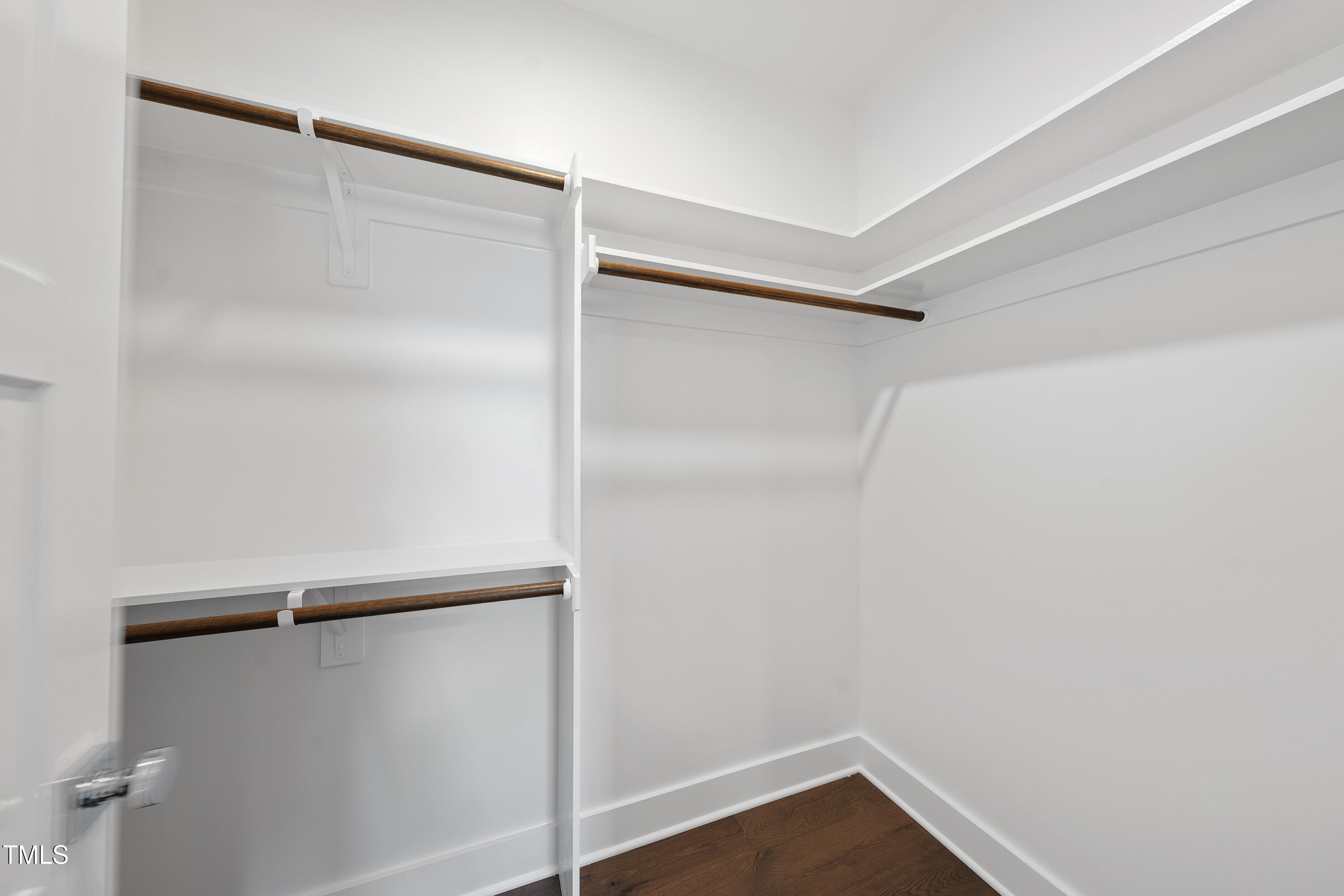 10119 2nd Star Court Raleigh, NC 27613 - Photo 30 of 39 a view of walk in closet with empty racks