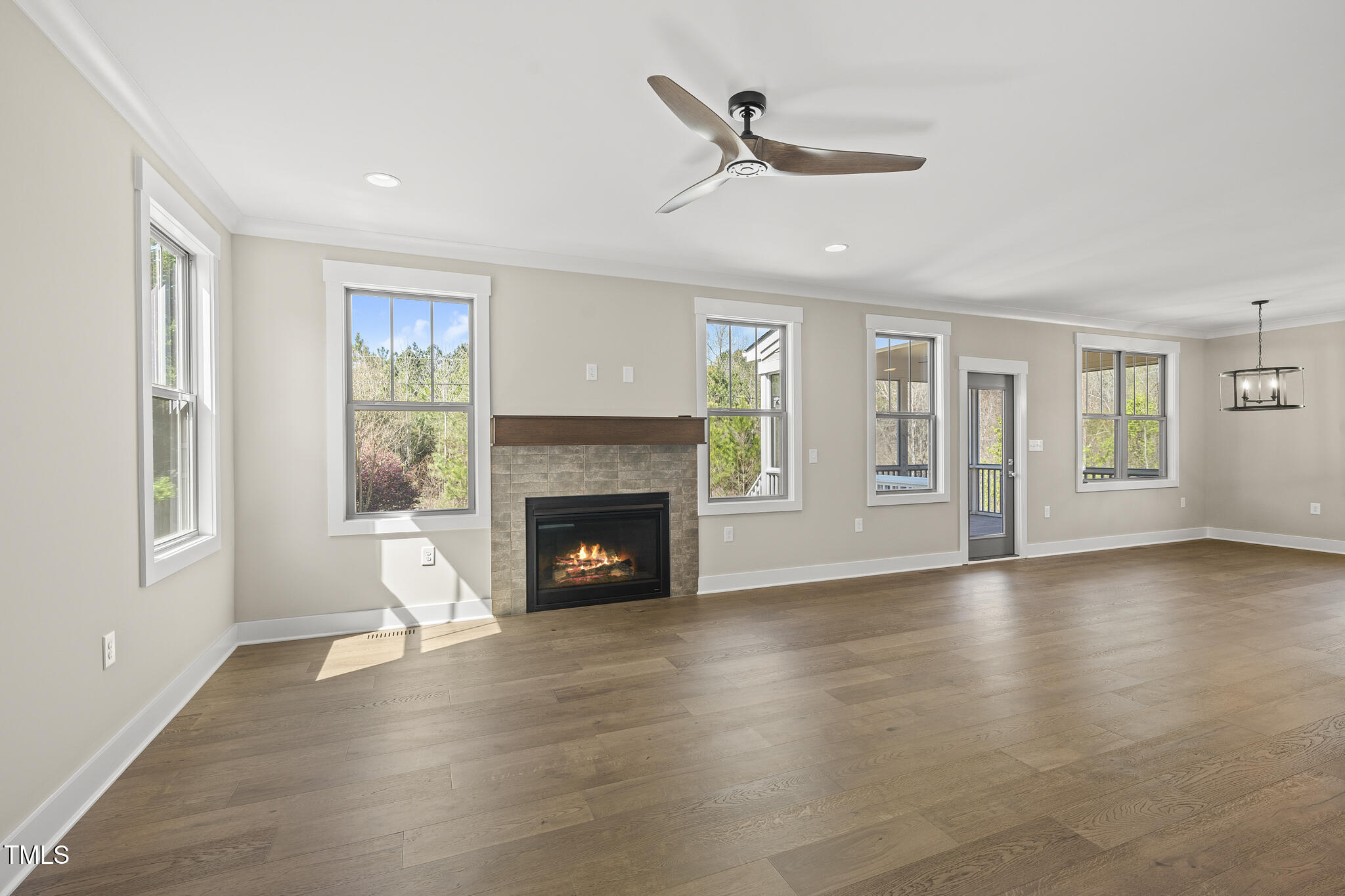 10119 2nd Star Court Raleigh, NC 27613 - Photo 5 of 39 a view of an empty room with window and fire place