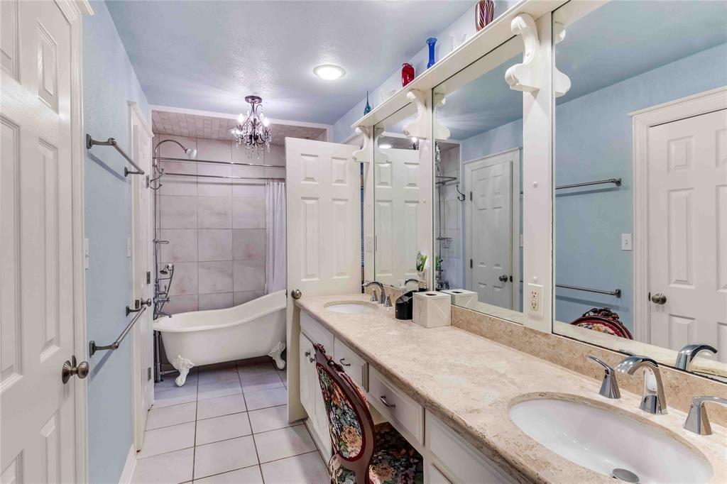 216 McMillen Road Lucas, TX 75002 - Photo 27 of 36 a bathroom with a granite countertop sink a toilet a mirror and shower