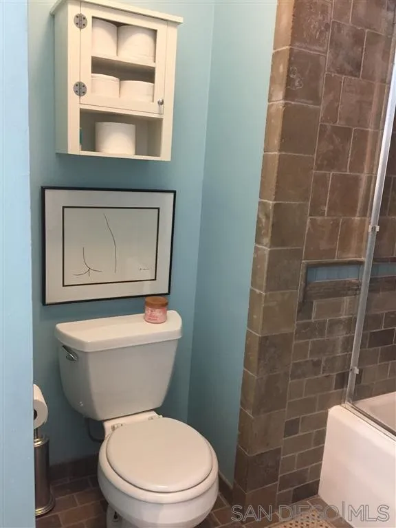 1939 Alga Road, Unit A Carlsbad, CA 92009 - Photo 12 of 25 a white toilet sitting next to a bathroom sink