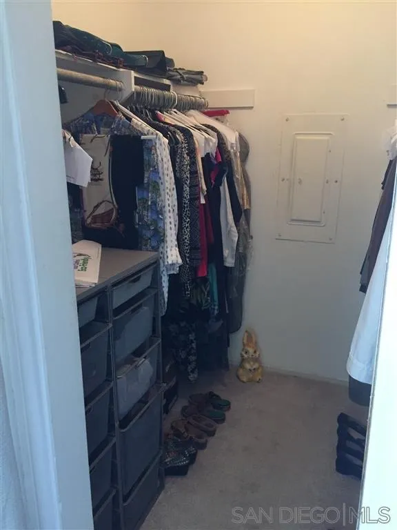 1939 Alga Road, Unit A Carlsbad, CA 92009 - Photo 13 of 25 a view of walk in closet with clothes and shoes