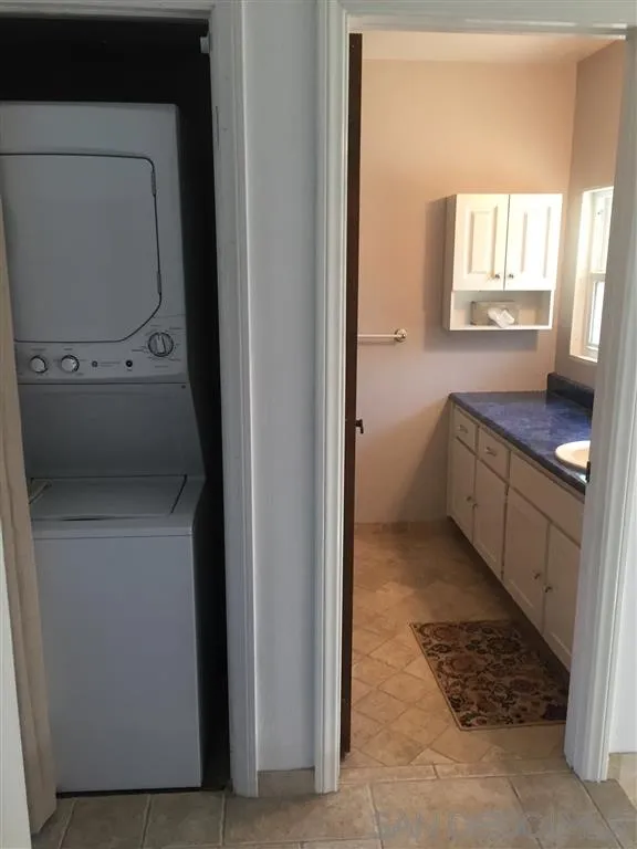 1939 Alga Road, Unit A Carlsbad, CA 92009 - Photo 18 of 25 a bathroom with a sink toilet and mirror