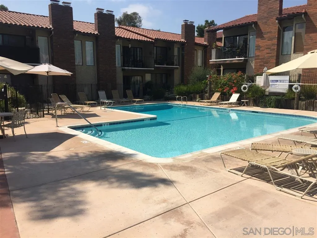 1939 Alga Road, Unit A Carlsbad, CA 92009 - Photo 21 of 25 a view of swimming pool in front of residential houses