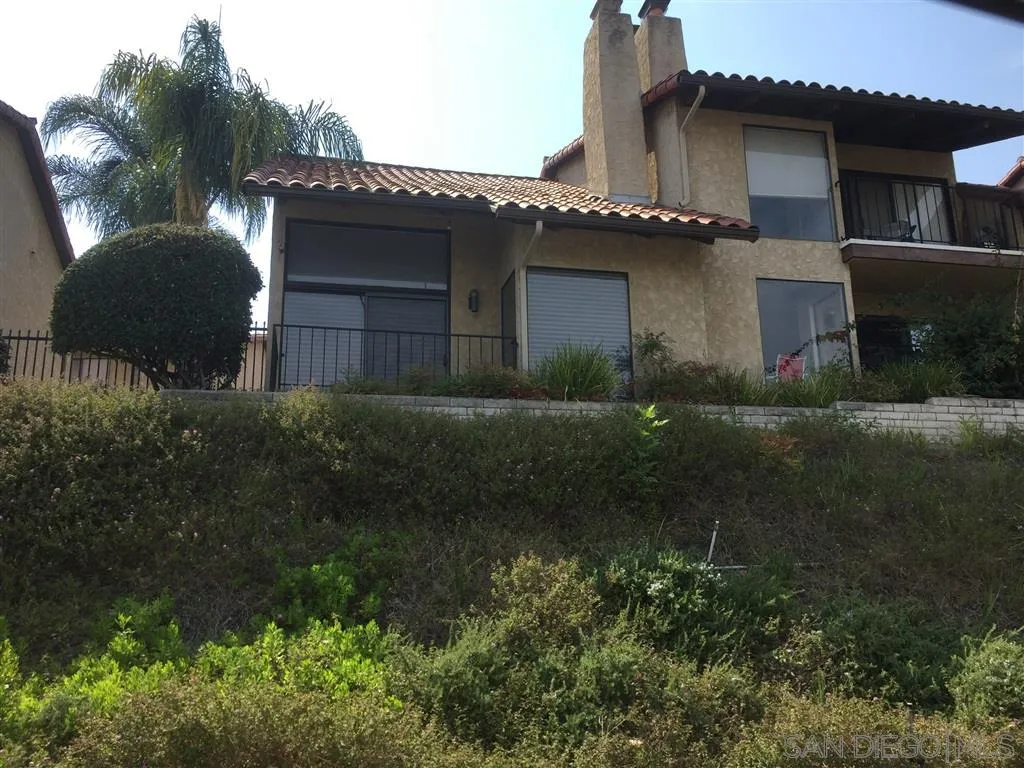 1939 Alga Road, Unit A Carlsbad, CA 92009 - Photo 24 of 25 a front view of a house with a yard