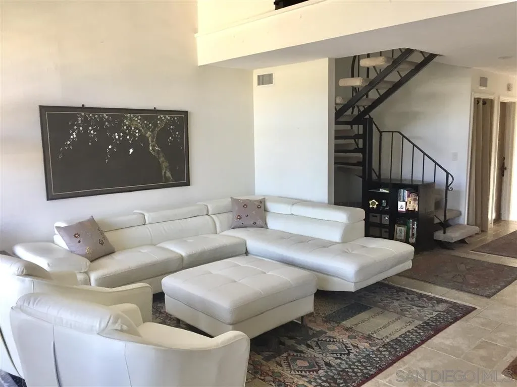1939 Alga Road, Unit A Carlsbad, CA 92009 - Photo 3 of 25 a living room with furniture and wooden floor