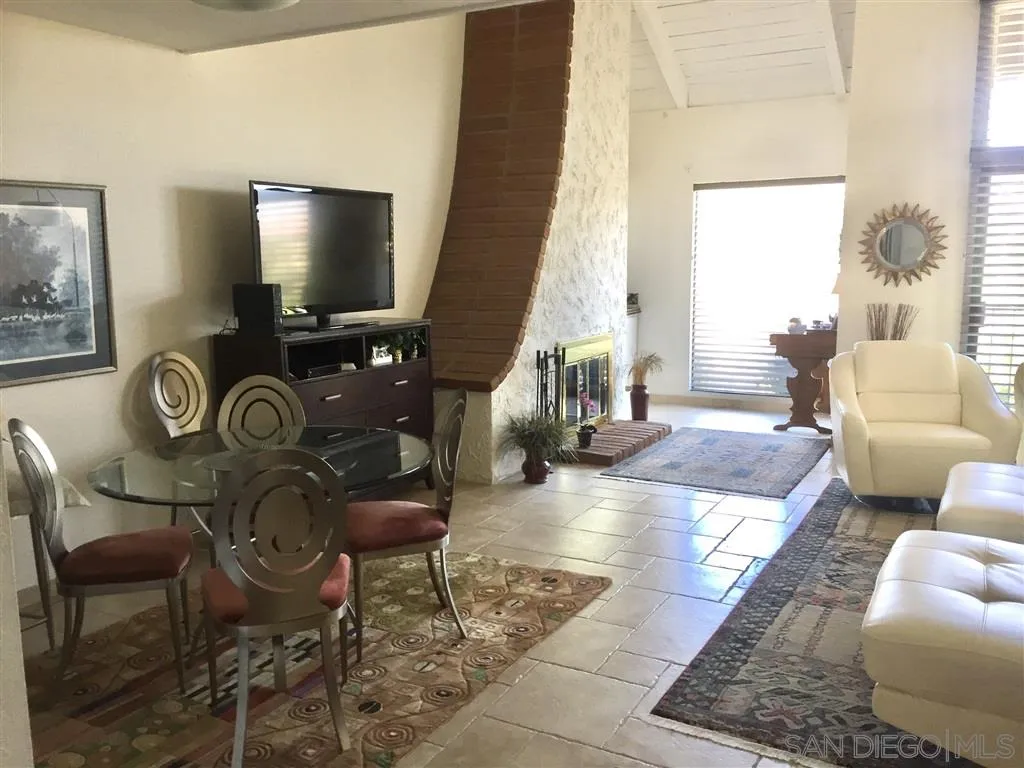 1939 Alga Road, Unit A Carlsbad, CA 92009 - Photo 4 of 25 a living room with furniture and a flat screen tv