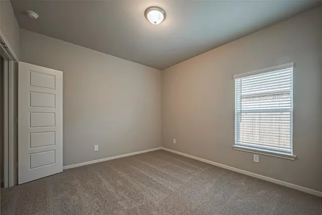 a kitchen with a sink and living room