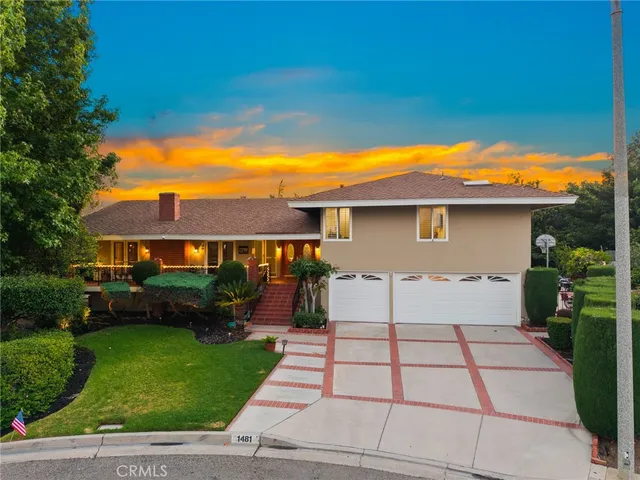 a view of a house with a garden