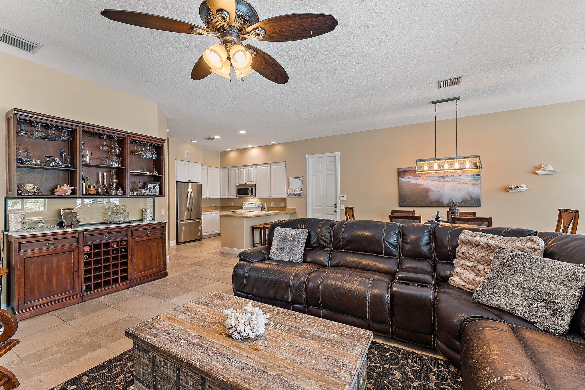334 Caravelle Drive Jupiter, FL 33458 - Photo 55 of 55 a living room with furniture and a wooden floor