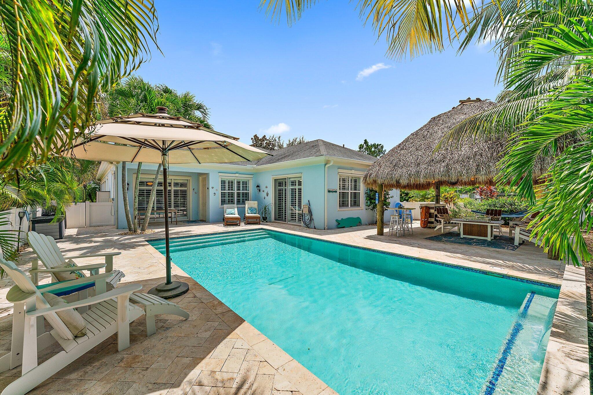 334 Caravelle Drive Jupiter, FL 33458 - Photo 36 of 55 a view of a house with swimming pool and sitting area