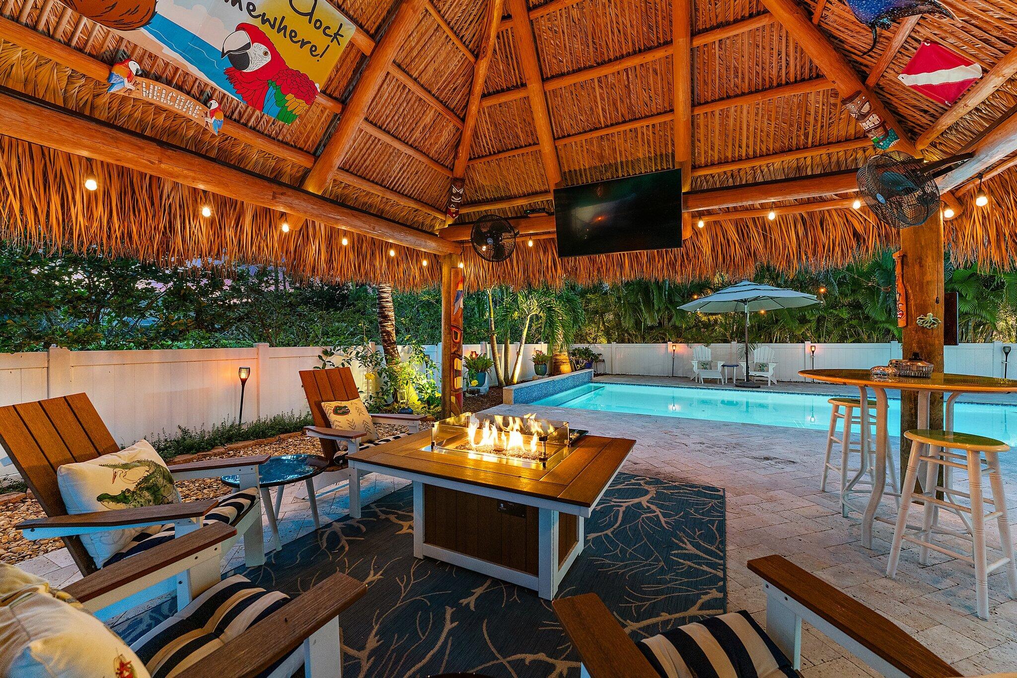 334 Caravelle Drive Jupiter, FL 33458 - Photo 43 of 55 a view of a patio with a table and chairs