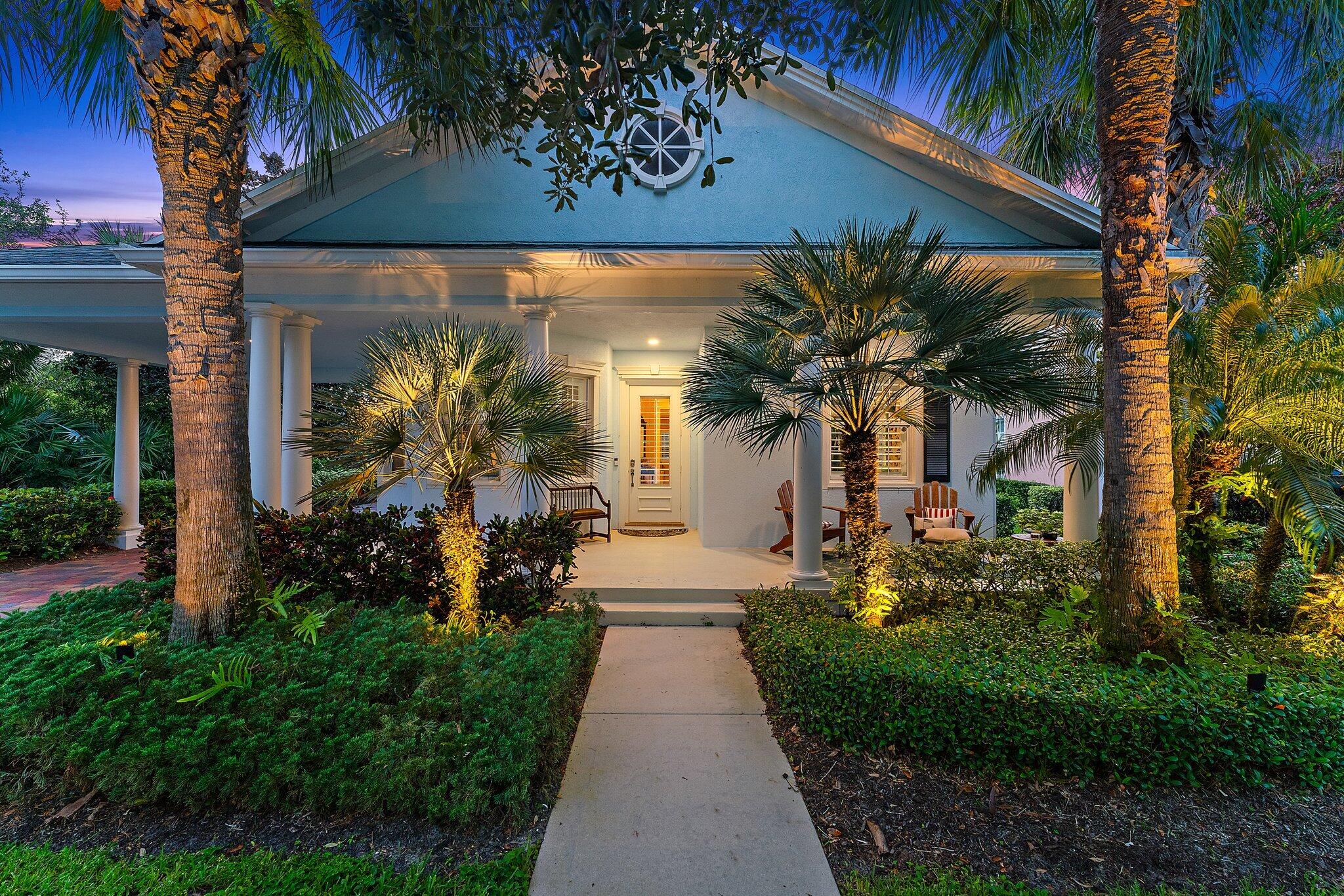 334 Caravelle Drive Jupiter, FL 33458 - Photo 5 of 55 a view of a house with a yard