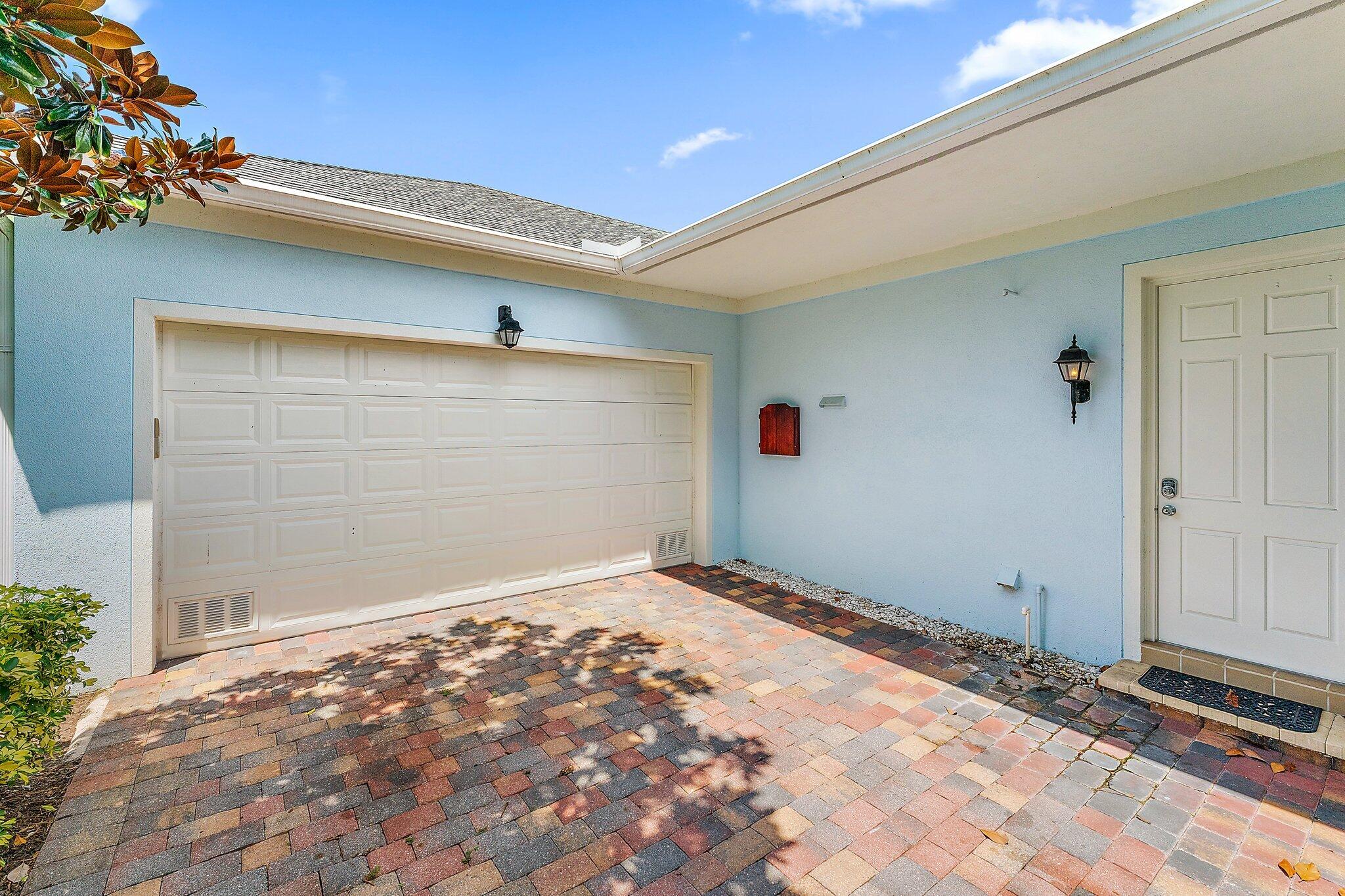 334 Caravelle Drive Jupiter, FL 33458 - Photo 50 of 55 Garage - Side door View