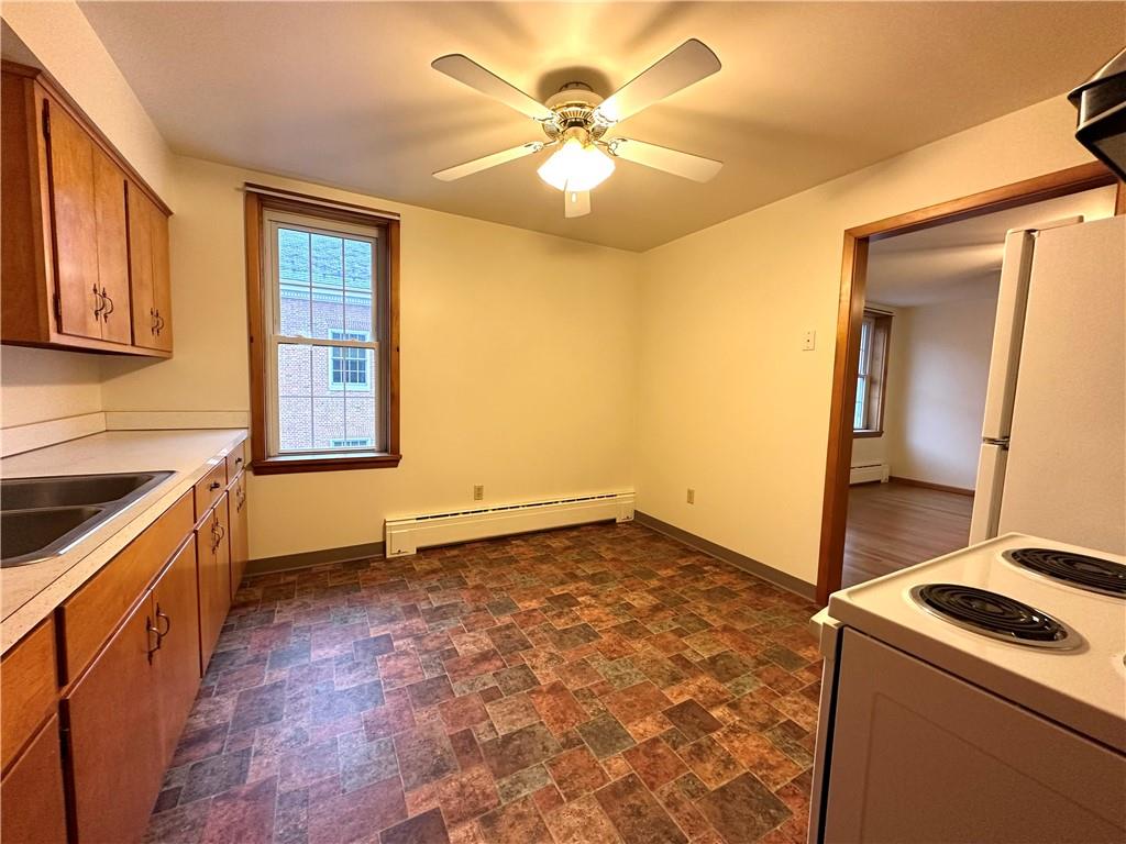 116 East Main Street Ligonier, PA 15658 - Photo 11 of 17 a view of a kitchen with a sink and a stove top oven