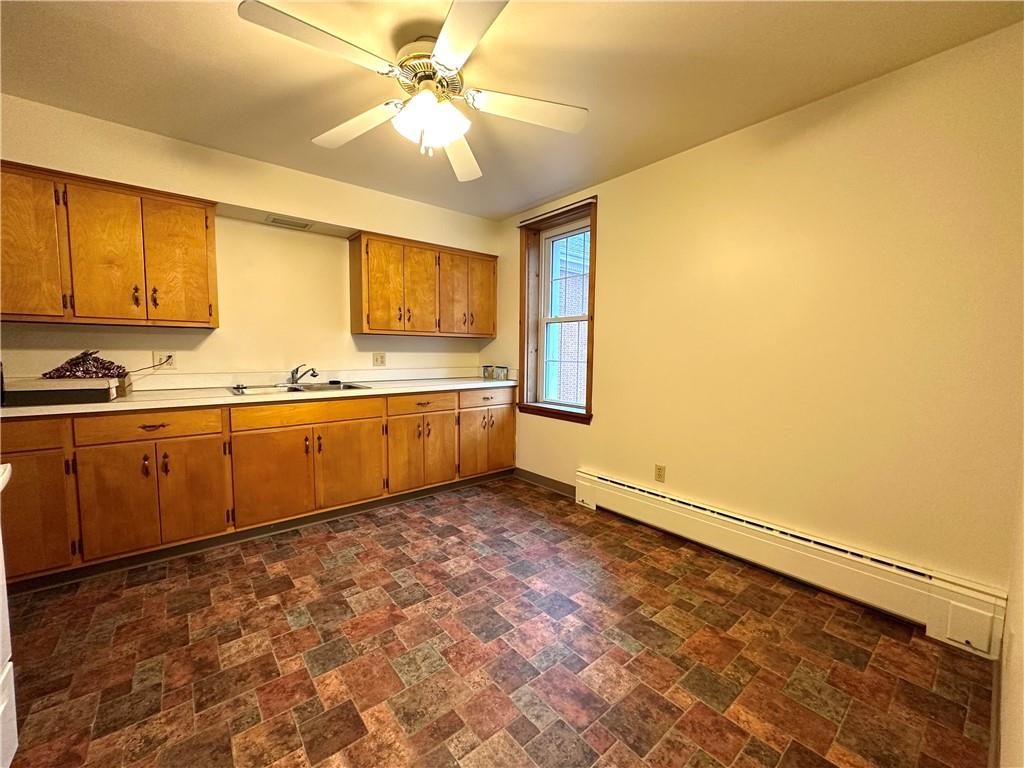 116 East Main Street Ligonier, PA 15658 - Photo 12 of 17 a view of a kitchen with wooden floor and a window