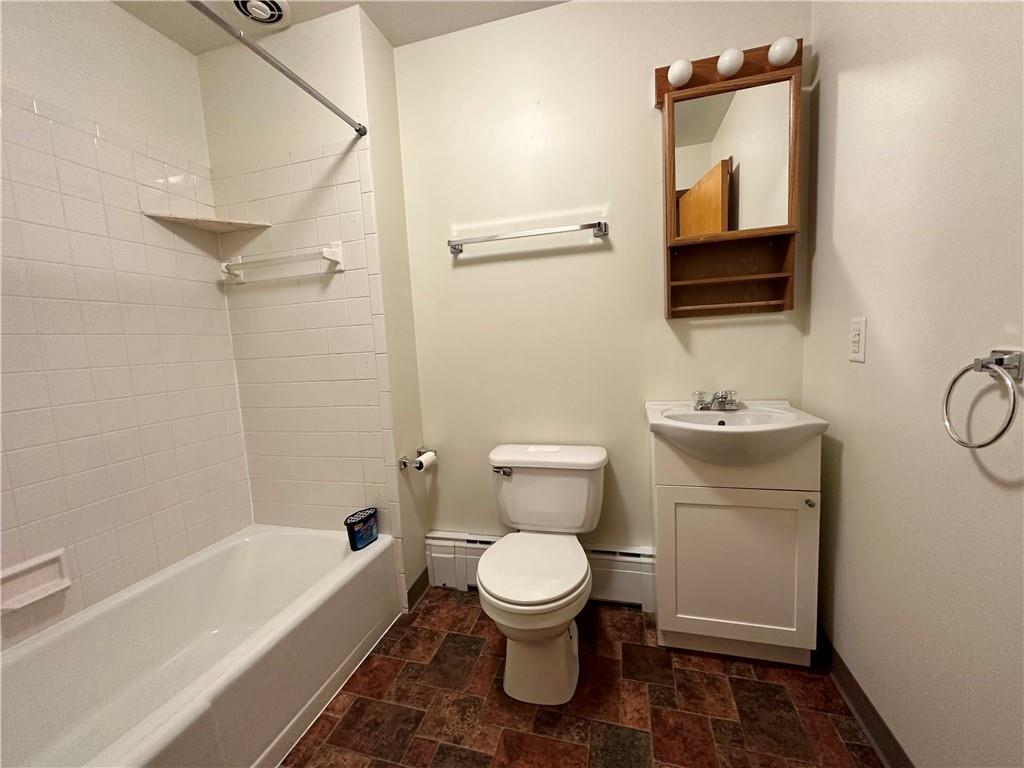 116 East Main Street Ligonier, PA 15658 - Photo 13 of 17 a bathroom with a toilet a sink and bathtub