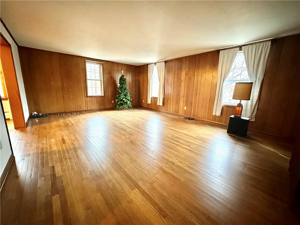 116 East Main Street Ligonier, PA 15658 - Photo 8 of 17 a view of a livingroom with wooden floor and window