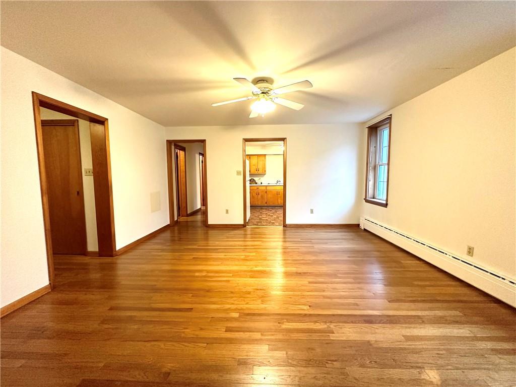 116 East Main Street Ligonier, PA 15658 - Photo 10 of 17 a view of an empty room with window and wooden floor