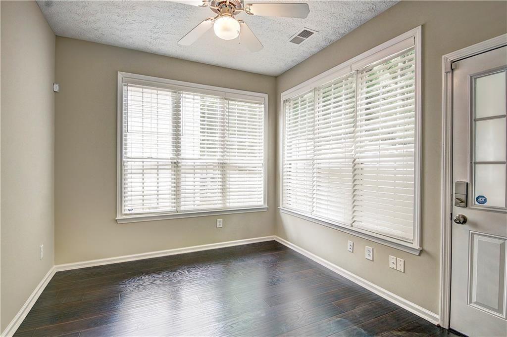 1643 Jackson Way Atlanta, GA 30318 - Photo 11 of 22 a view of an empty room with a window and wooden floor