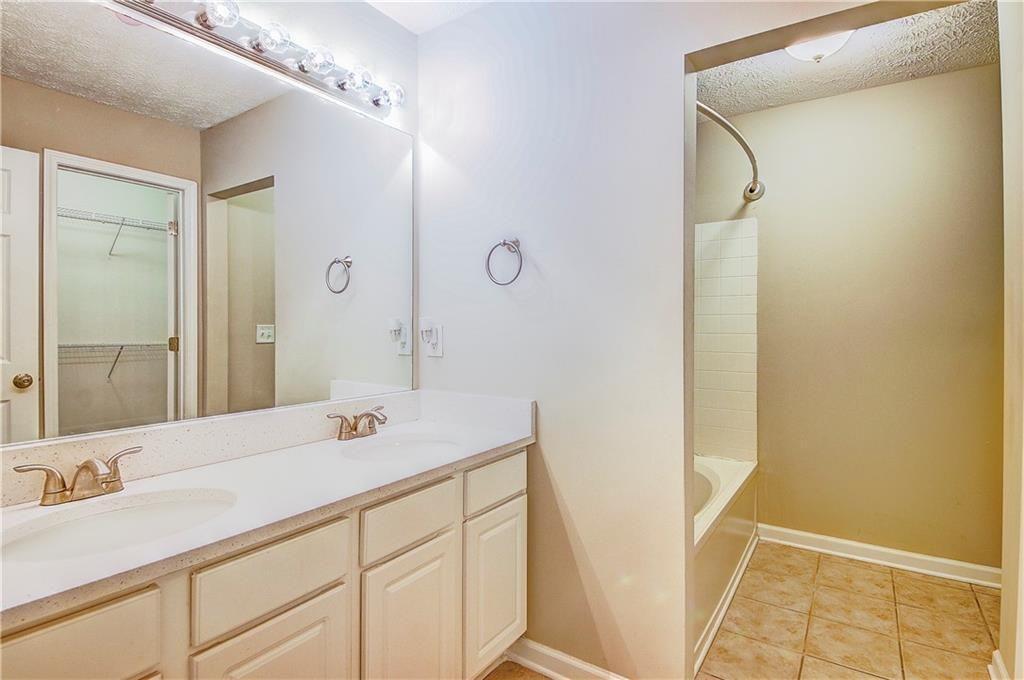 1643 Jackson Way Atlanta, GA 30318 - Photo 16 of 22 a bathroom with a sink and a mirror