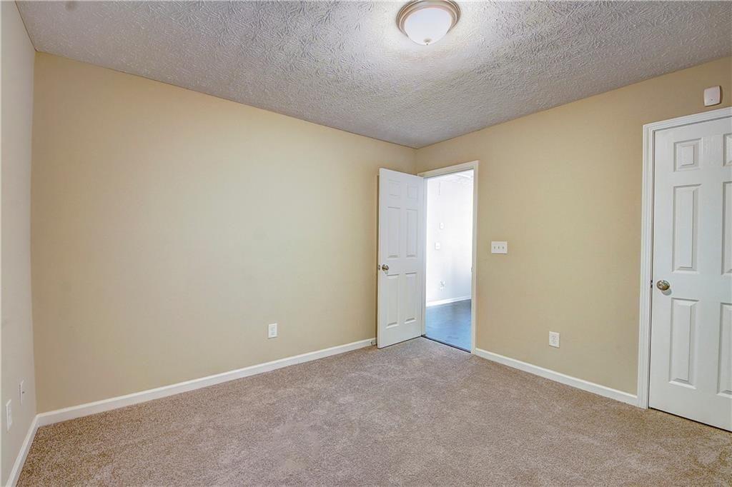 1643 Jackson Way Atlanta, GA 30318 - Photo 17 of 22 an empty room with an entryway