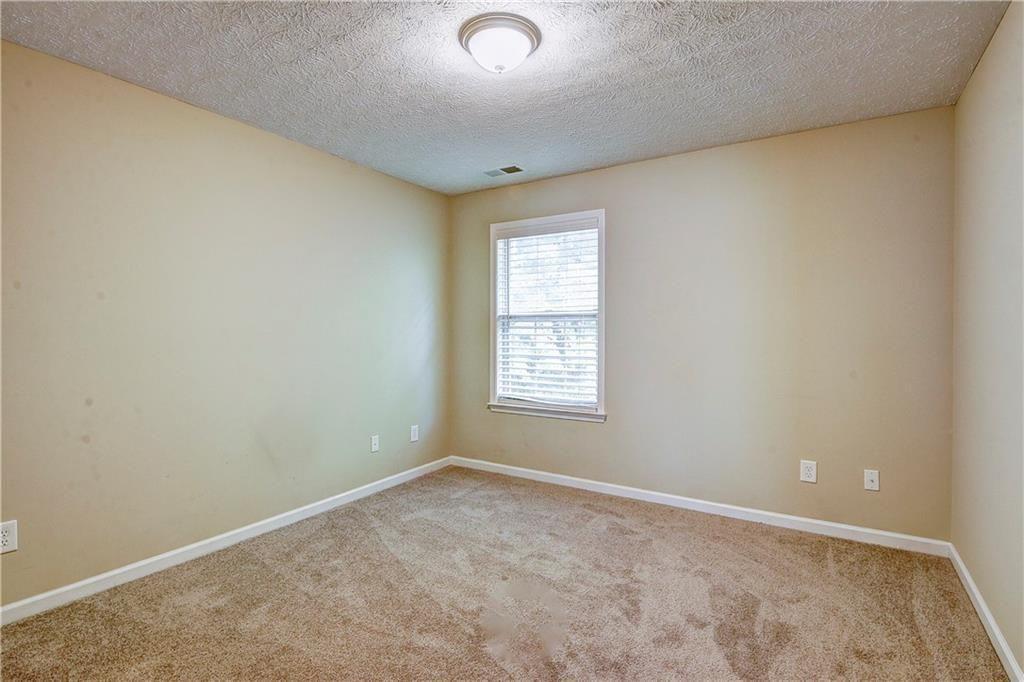 1643 Jackson Way Atlanta, GA 30318 - Photo 18 of 22 an empty room with windows