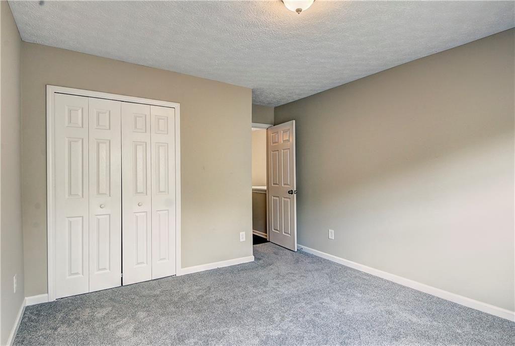 1643 Jackson Way Atlanta, GA 30318 - Photo 19 of 22 a view of an empty room and closet area
