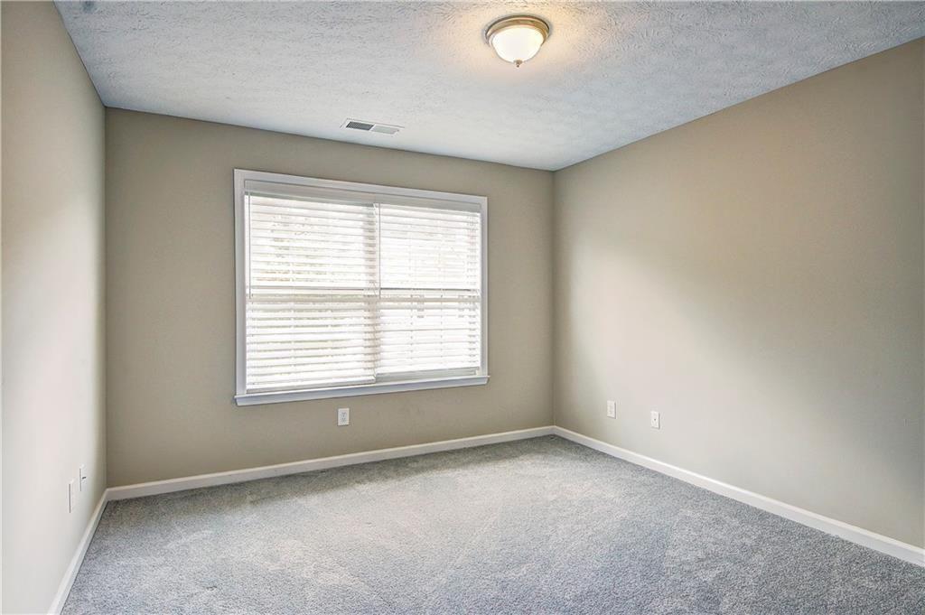 1643 Jackson Way Atlanta, GA 30318 - Photo 20 of 22 an empty room with a window