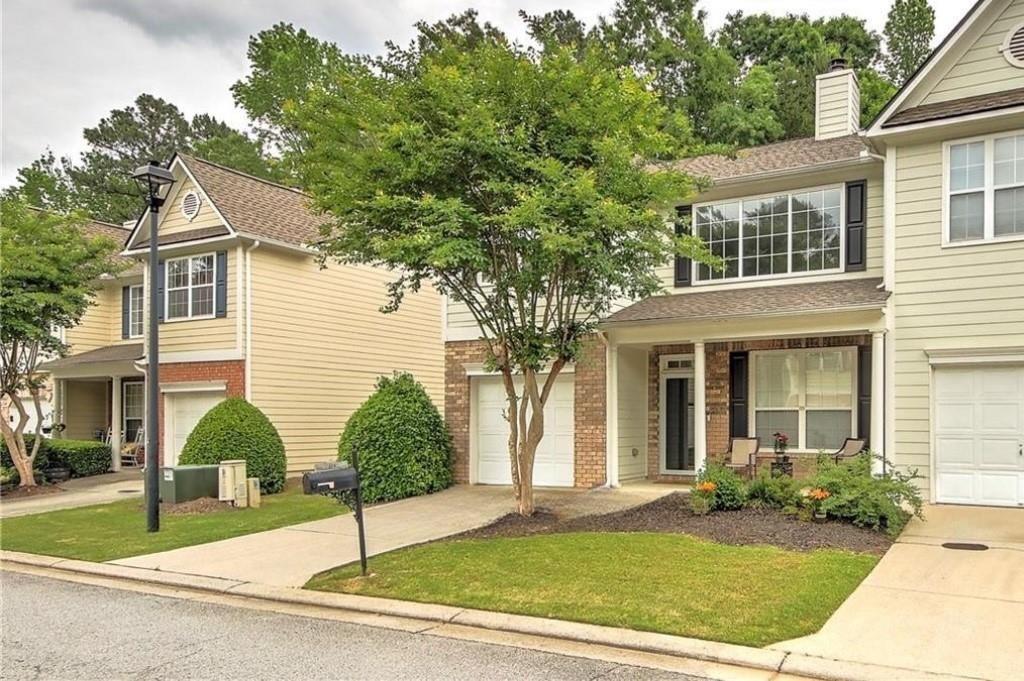 1643 Jackson Way Atlanta, GA 30318 - Photo 2 of 22 a view of a white house next to a yard and road
