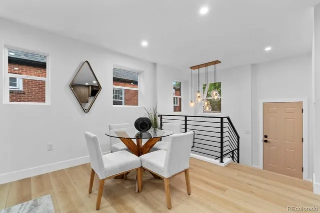 a view of a dining room with furniture and a window