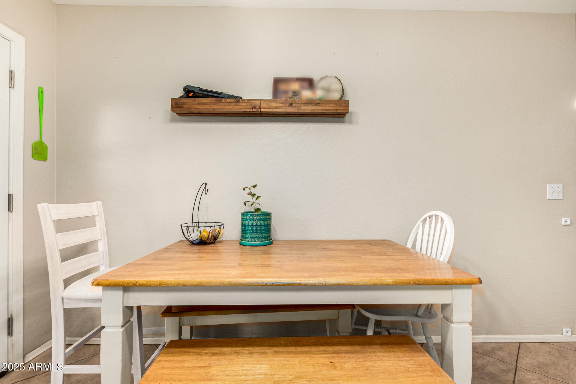16214 West Boca Raton Road Surprise, AZ 85379 - Photo 8 of 25 a room with a table and chairs