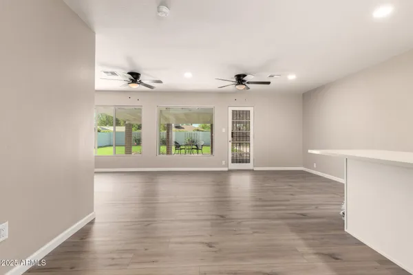 a view of a kitchen with a dishwasher and wooden floor