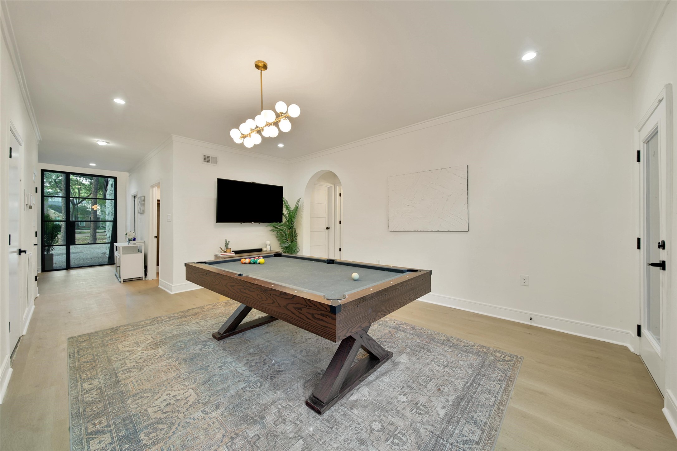 140 South Timber Top Drive Spring, TX 77380 - Photo 26 of 38 a room with chandelier pool table and flat screen tv