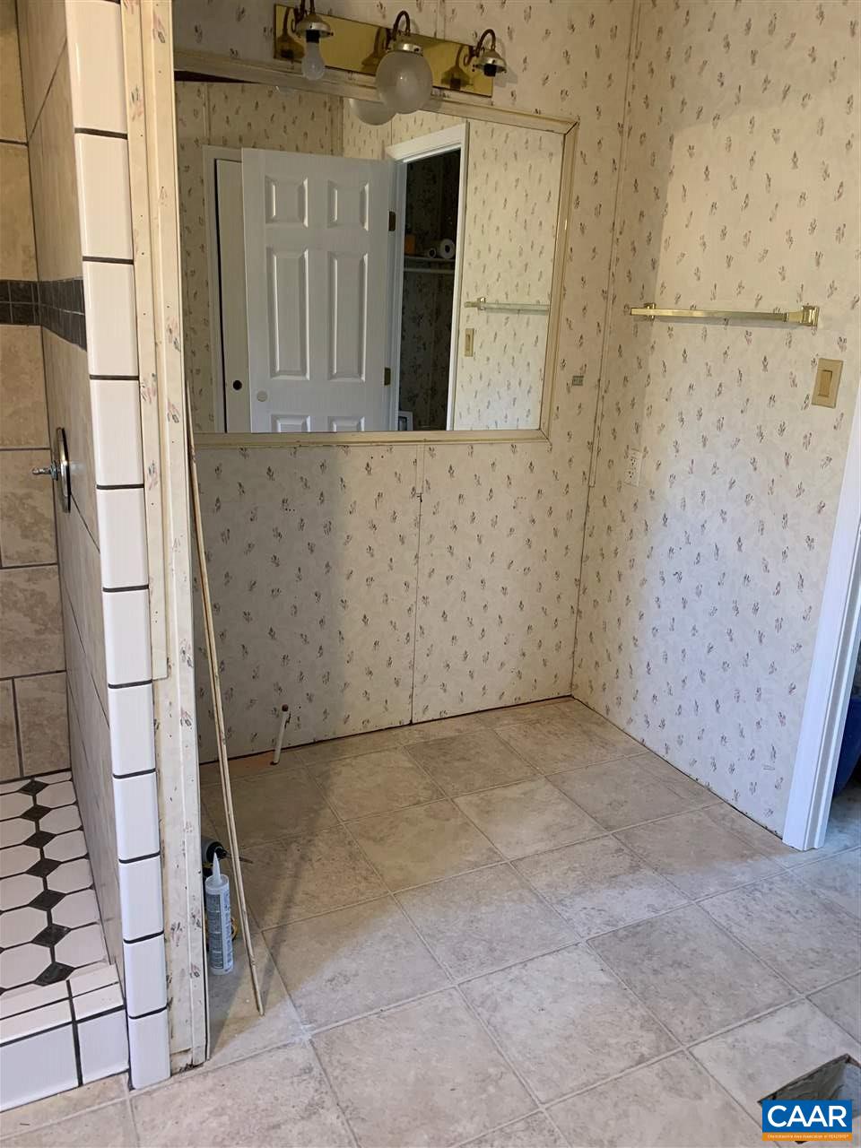 8914 Durrette Road Afton, VA 22920 - Photo 22 of 30 a view of a utility room with brick wall
