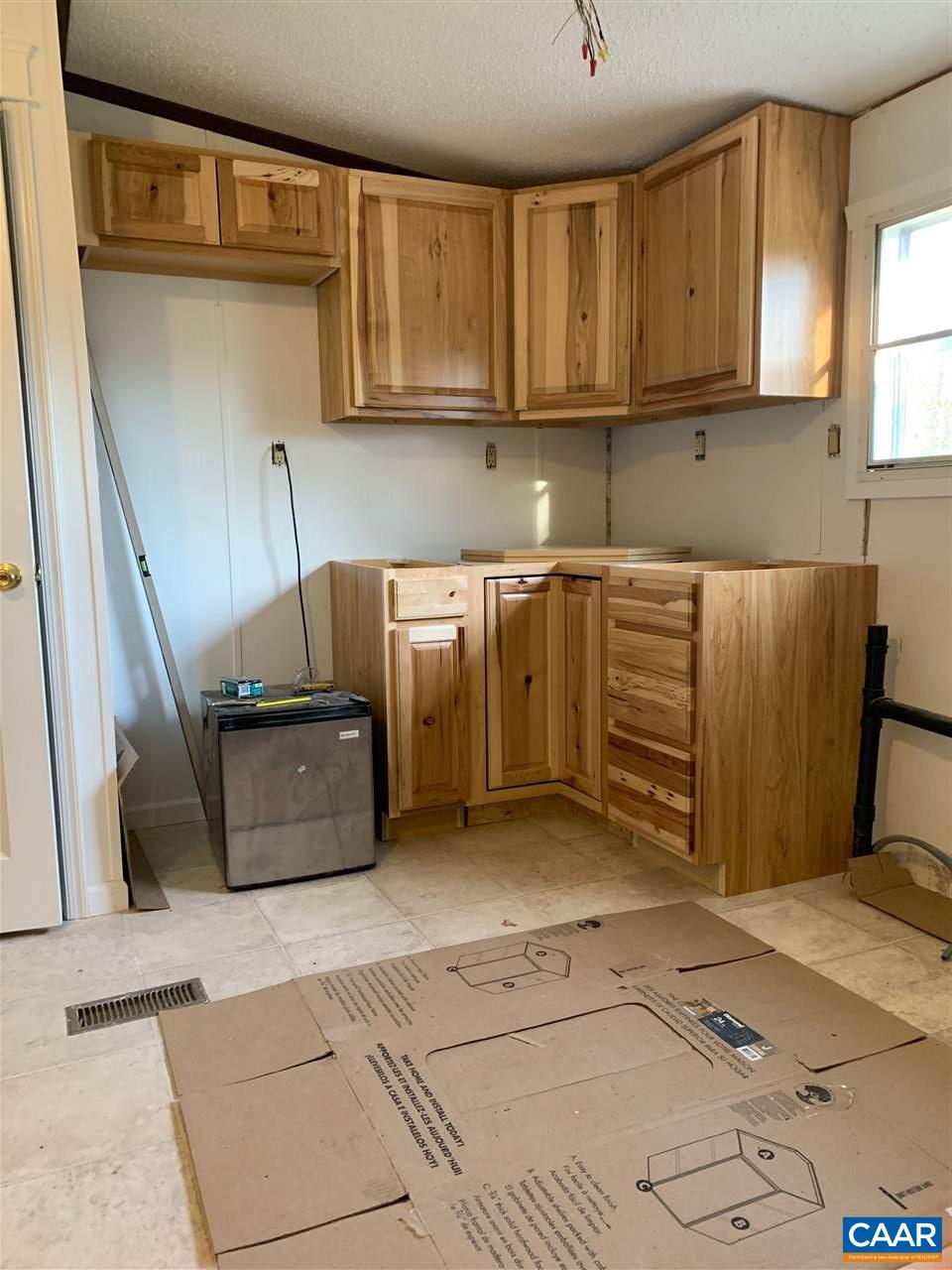 8914 Durrette Road Afton, VA 22920 - Photo 7 of 30 a kitchen with stainless steel appliances wooden cabinets a stove and a refrigerator