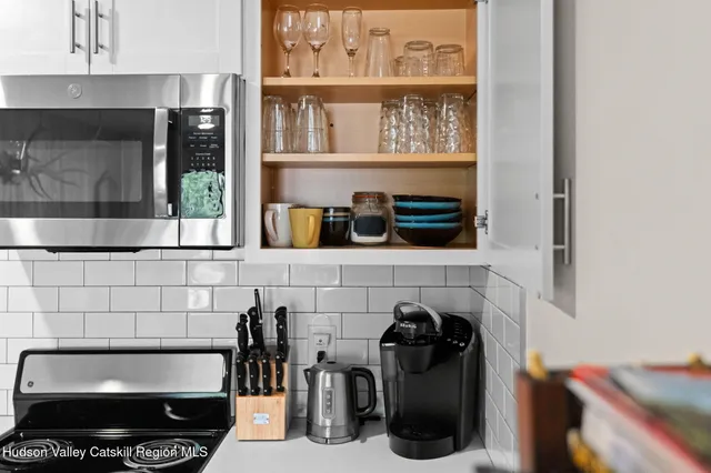 a living room with furniture a table and a chandelier