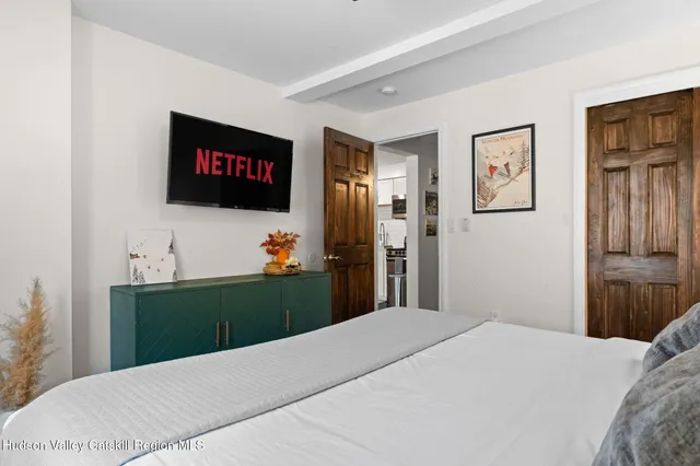 a bathroom with a shower a toilet and sink